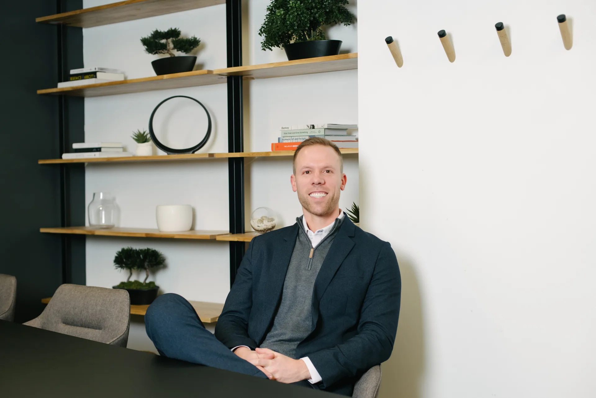 Quadshift team member seated at a boardroom table