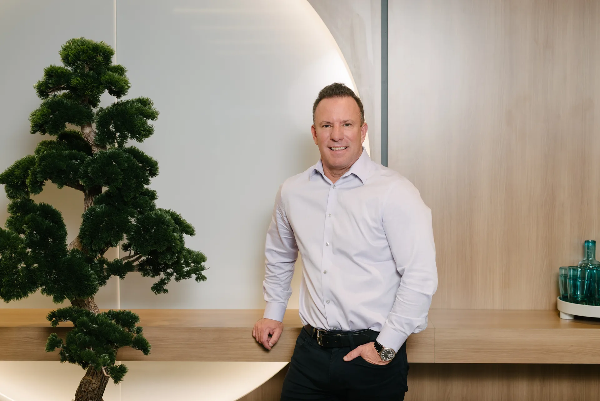 Quadshift team member standing at an office counter